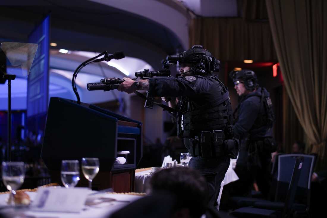 Agents stand guard after the shooting at the annual White House Correspondents Association Dinner on Saturday.