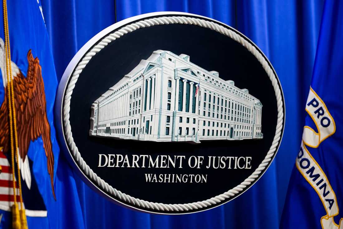 The U.S. Department of Justice logo is before a news conference, Monday, May 4, 2026, in Washington.