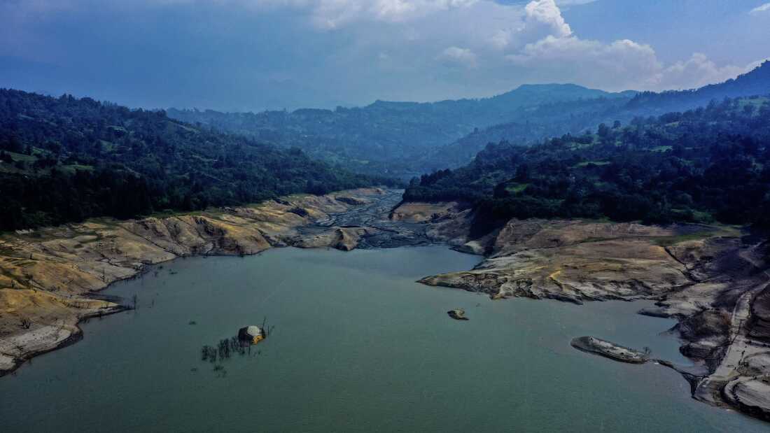 Forecasters are warning that a new El Niño weather pattern could bring strong impacts to areas around the world. In this 2024 photo, dramatically low water levels are seen in a reservoir feeding the Guavio Hydroelectric Power Plant in Gachalá, in Colombia's Guavio Province, during dry conditions linked to El Niño.